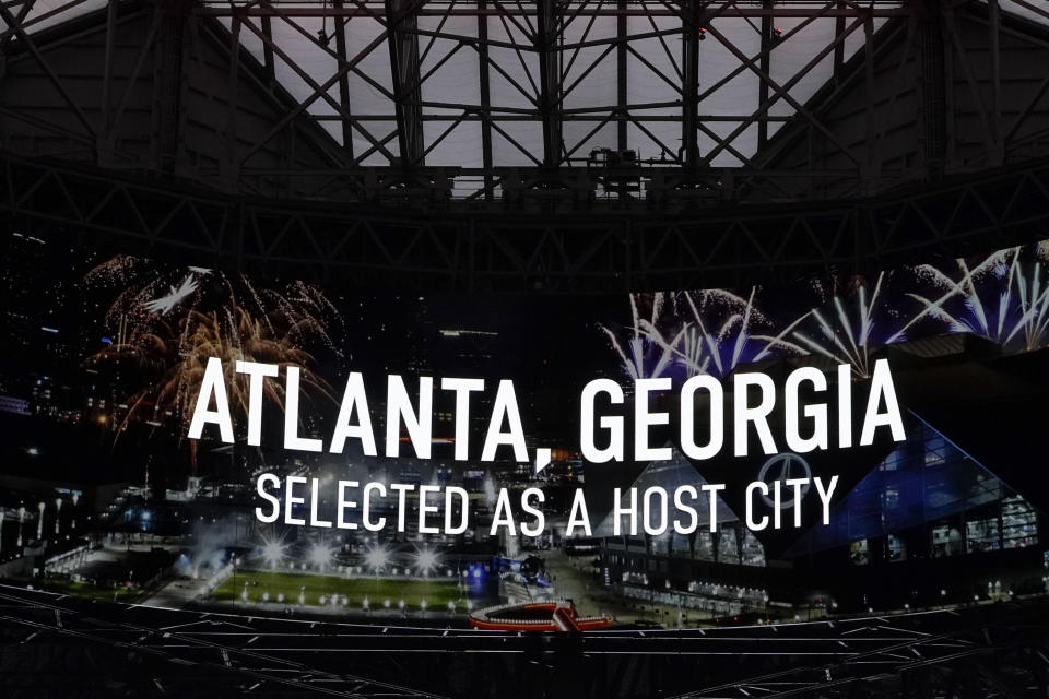 Mercedes-Benz Stadium displays an announcement that FIFA has selected Atlanta as a 2026 soccer World Cup host city, Thursday, June 16, 2022, in Atlanta. (AP Photo/Brynn Anderson)