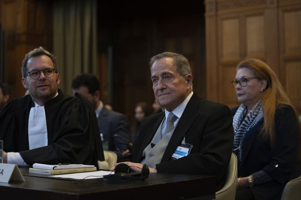 Nicaragua's Ambassador Carlos Jose Arguello Gomez, center, waits for judges to enter the International Court of Justice in The Hague, Netherlands, Tuesday, April 30, 2024, where the United Nations' top court is ruling on a request by Nicaragua for judges to order Germany to halt military aid to Israel, arguing that Berlin's support enables acts of genocide and breaches of international humanitarian law in Gaza. (AP Photo/Peter Dejong)