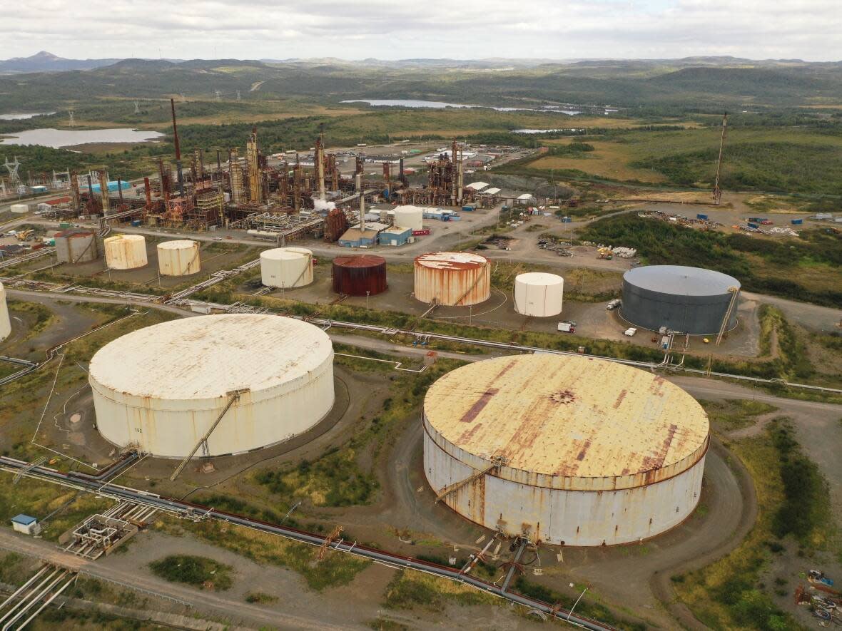 The Newfoundland and Labrador government has agreed to an environmental indemnity of up to $180 million for potential liabilities at the Come By Chance refinery, pictured here in September. (CBC - image credit)