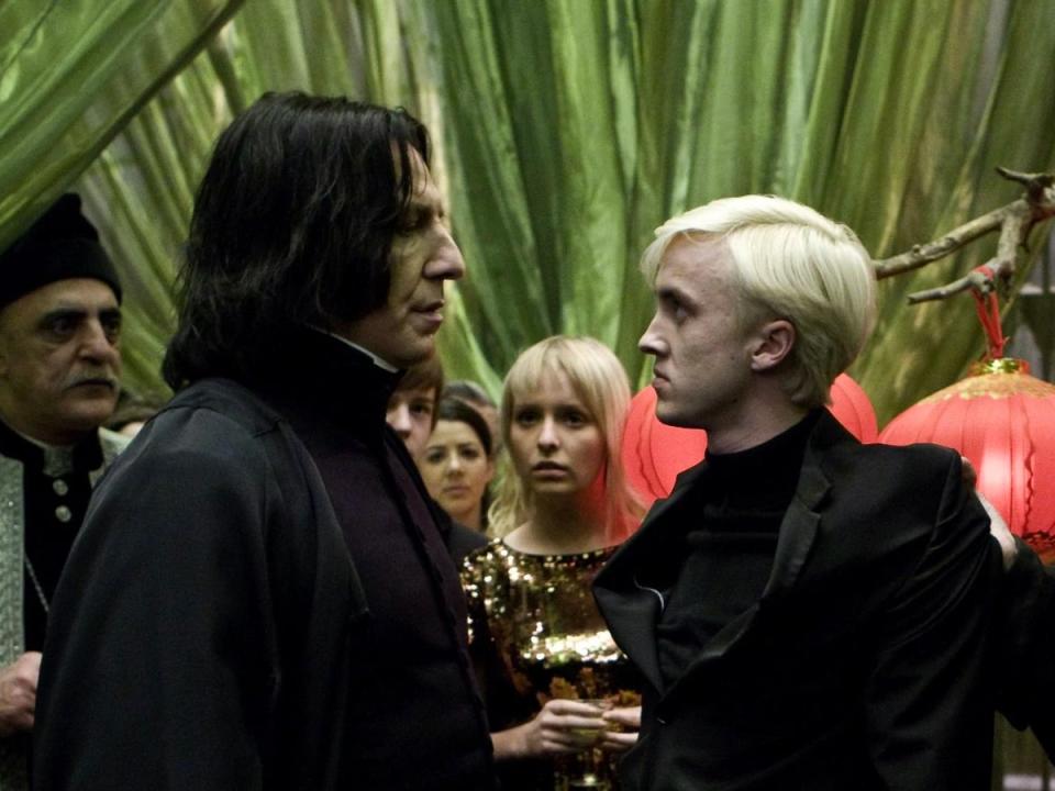Alan Rickman (left) and Tom Felton in Harry Potter (Warner Bros)