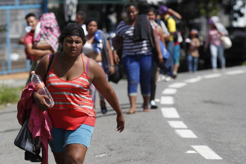 Central American migrants making their way to the U.S. arrive by foot to Tapachula, Mexico, Sunday, Oct. 21, 2018. Despite Mexican efforts to stop them at the Guatemala-Mexico border, about 5,000 Central American migrants resumed their advance toward the U.S. border Sunday in southern Mexico. (AP Photo/Moises Castillo)