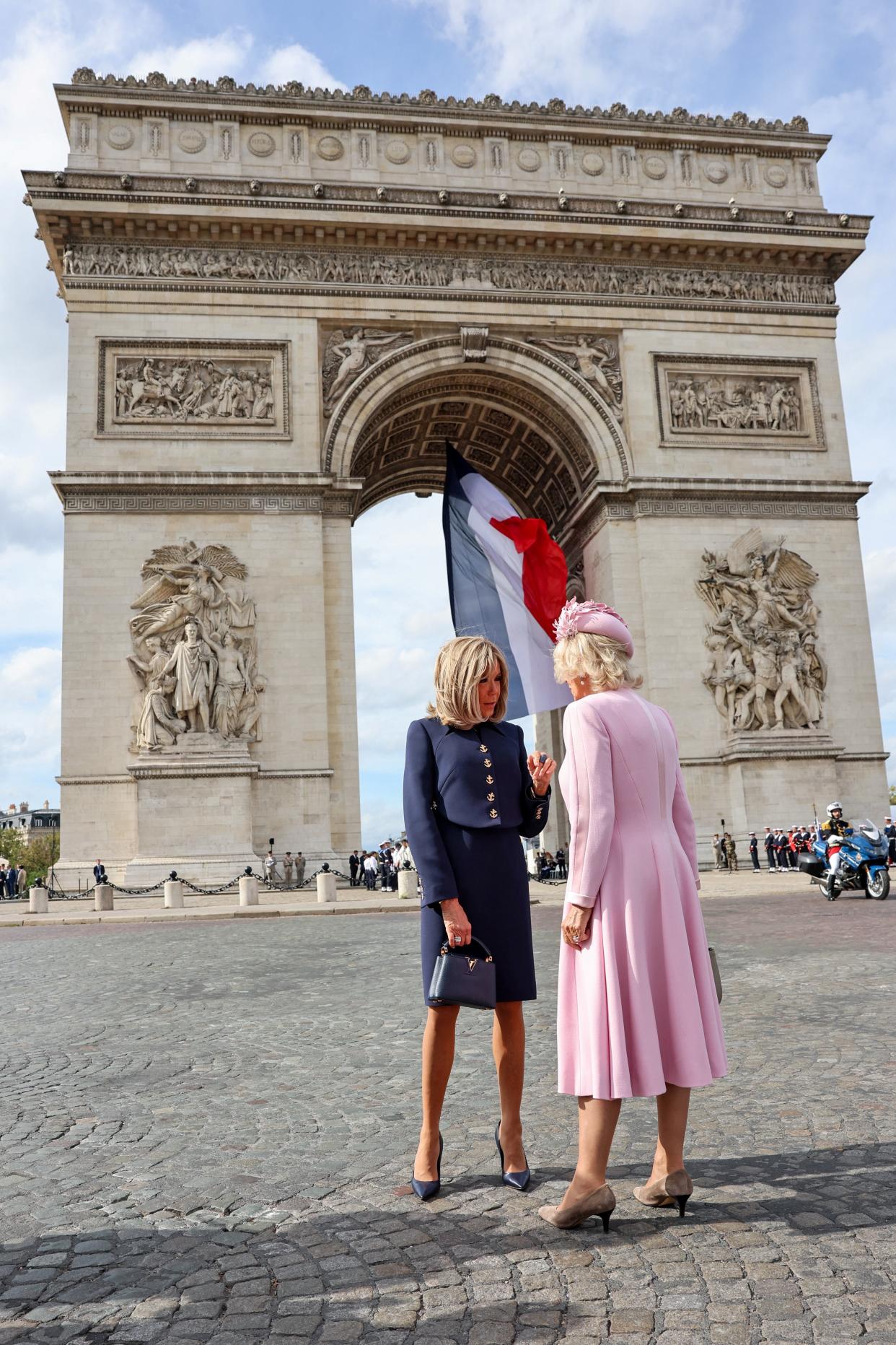 Brigitte Macron and Queen Camilla talk after a ceremonial welcome at The Arc De Triomphe (via REUTERS)