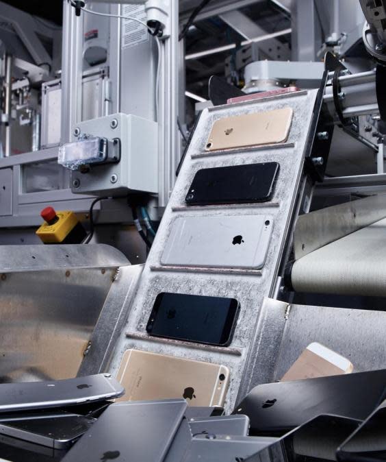 Apple shows off robot for tearing down iPhones as it reveals new recycling programmes