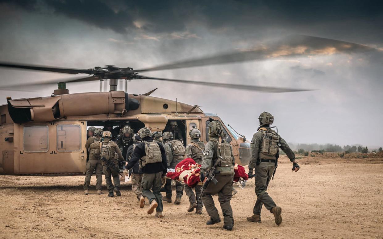 Israeli troops evacuating a wounded soldier during operations in the Gaza Strip