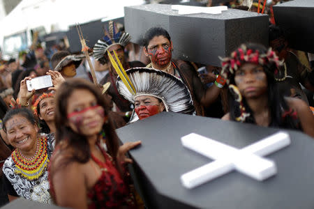 Brazilian Indians take part in a demonstration against the violation of indigenous people's rights, in Brasilia, Brazil April 25, 2017. REUTERS/Ueslei Marcelino