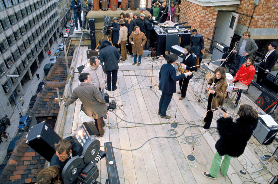 The Beatles film the rooftop sequence for the “Let It Be” film in January 1969, as pictured in the book “Get Back” - Credit: Courtesy Apple