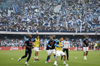 Napoli players warm up on the field before a Serie A soccer match between Napoli and Salernitana, at Naples' Diego Armando Maradona stadium, Italy, Sunday, April 30, 2021. Napoli fans are already celebrating in anticipation of sealing the club’s first Italian league title since the days when Diego Maradona played for the club. (Alessandro Garofalo/LaPresse via AP)