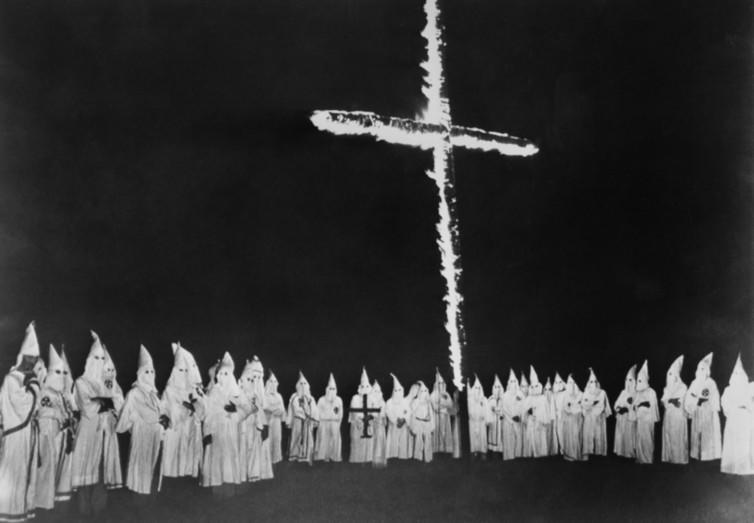 <span class="caption">Ku Klux Klan at a cross burning in Tennessee. September 4, 1948.</span> <span class="attribution"><a class="link " href="https://www.shutterstock.com/image-photo/ku-klux-klan-cross-burning-tennessee-251929858?src=ae3zjy9NgLbG-dyOQsWqiw-1-1" rel="nofollow noopener" target="_blank" data-ylk="slk:Shutterstock;elm:context_link;itc:0;sec:content-canvas">Shutterstock</a></span>