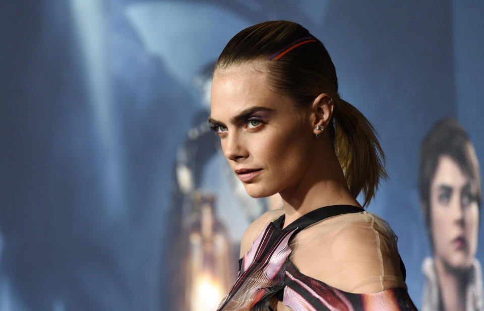 Cara Delevingne, a cast member in the Amazon Prime Video series "Carnival Row," poses with his wife Emma at the premiere of the series at the TCL Chinese Theatre, Wednesday, Aug. 21, 2019, in Los Angeles. (Photo by Chris Pizzello/Invision/AP)