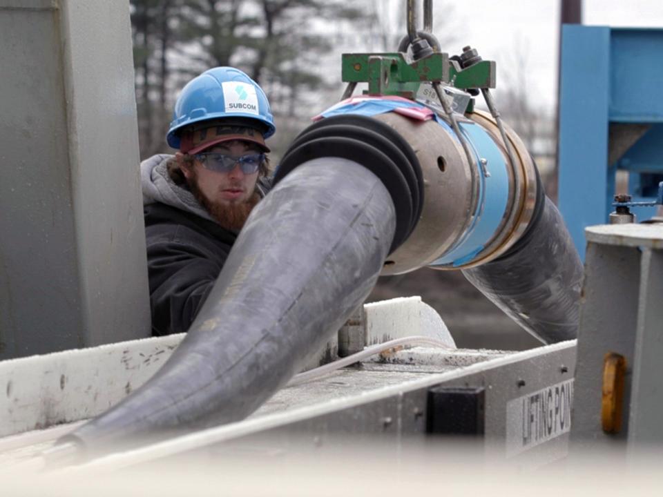 An amplifier is loaded onto a laying vessel.