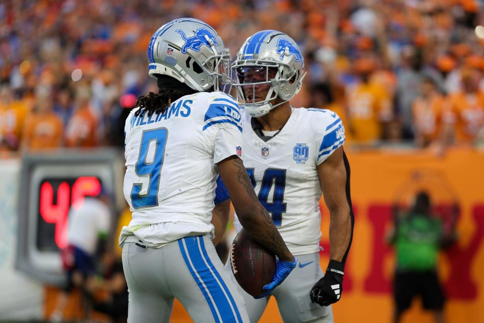 Detroit Lions wide receiver Jameson Williams is congratulate by wide receiver Amon-Ra St. Brown after scoring a touchdown against the Tampa Bay Buccaneers in the third quarter in the third quarter at Raymond James Stadium.