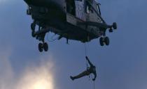 Atmosphere A member of the Royal Navy lowers himself to the ground from a Royal Navy helicopter with the Olympic Flame attached to his waist as it finally arrives in London London, England - 20.07.12 Mandatory Credit: WENN.com