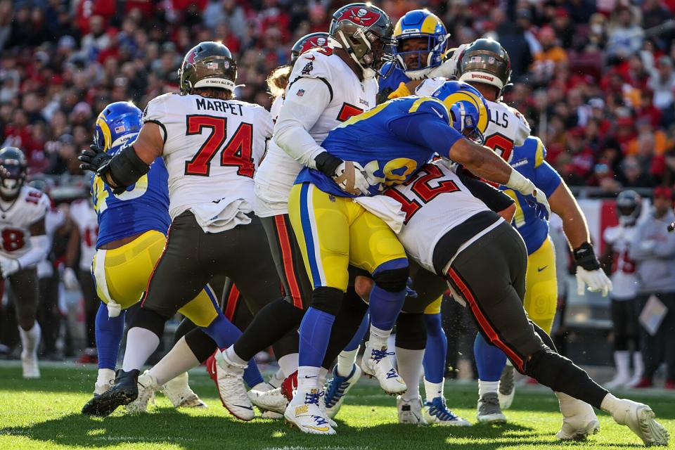 Rams lineman Aaron Donald (99) sacks Tampa Bay Buccaneers quarterback Tom Brady (12) in the second quarter.