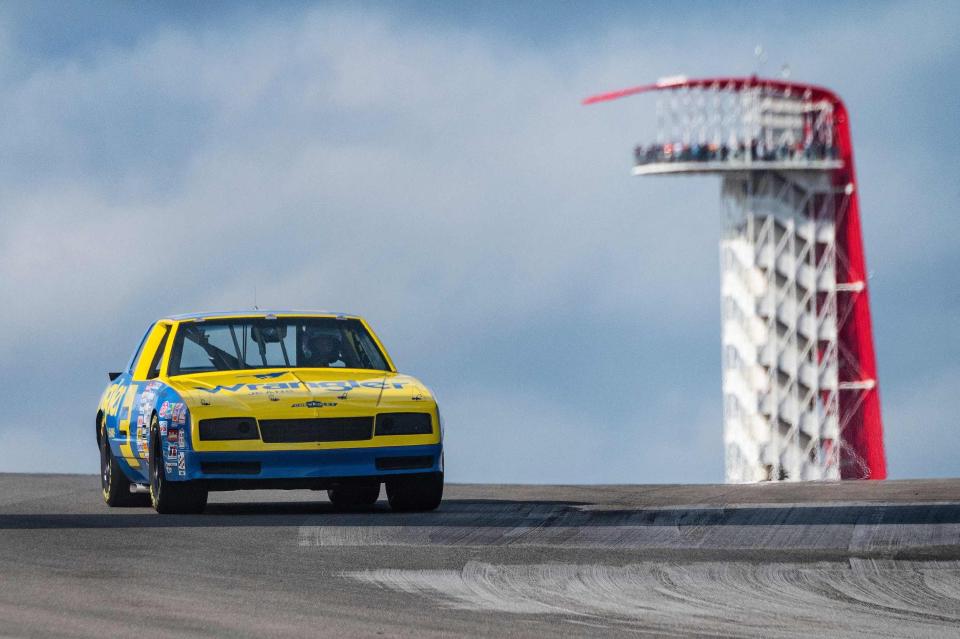 McLarens Australian driver Daniel Ricciardo drives the NASCAR 1984 Dale Earnhardt Cup car on the track at Circuit of the Americas in Austin, Texas