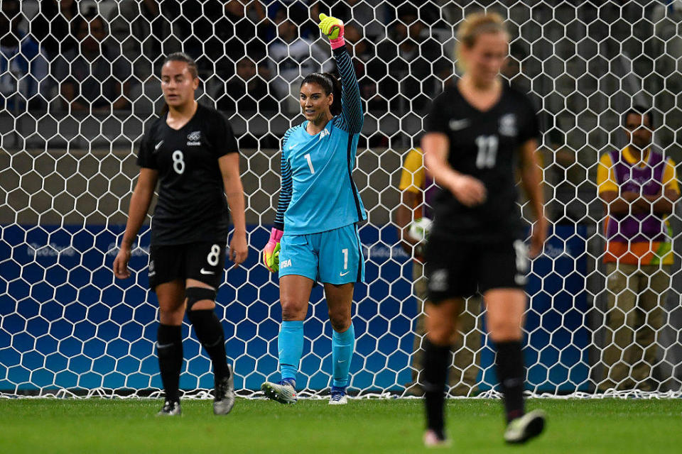 Hope Solo (1) of the United States celebrates as the game ends, while Jasmine Pereira (8) of New Zealand and Kirsty Yallop (11) react during the second half of the United States' 2-0 first round Rio 2016 group G match win. / Credit: AAron Ontiveroz/The Denver Post via Getty Images