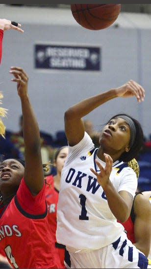 Oklahoma Wesleyan University's Zaraiah Tillman, right, battles for ball possession during women's basketball play against Friends (Kan.) University on Dec. 1, 2022.