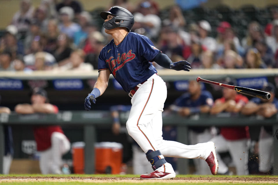 Minnesota Twins' Gio Urshela watches his walkoff two-run home run during the bottom of the tenth inning of a baseball game against the Detroit Tigers in Minneapolis, Monday, Aug. 1, 2022. (AP Photo/Abbie Parr)