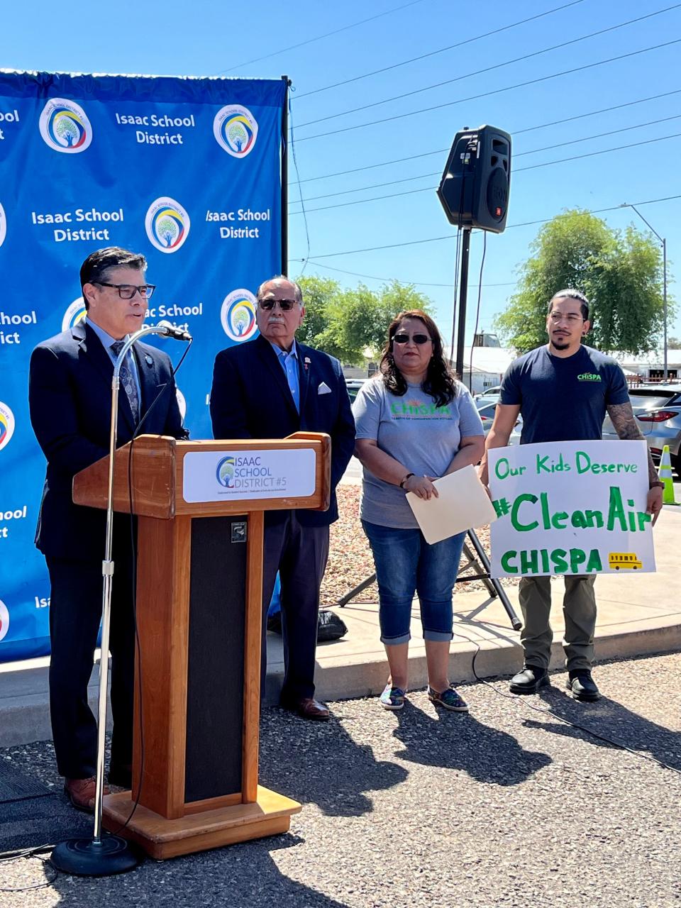 Isaac School District Superintendent Mario Ventura speaks at a news conference about electric school buses on May 9, 2023.