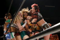 Wrestlers fight during their Stardom female professional wrestling show at Shinkiba 1st Ring in Tokyo, Japan, December 6, 2015. REUTERS/Thomas Peter