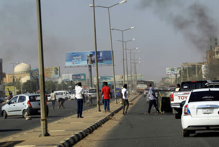 FILE PHOTO: Cars block a road as Sudanese demonstrators stage an anti-government protests in Khartoum, Sudan January 25, 2019. REUTERS/Mohamed Nureldin Abdallah/File Photo