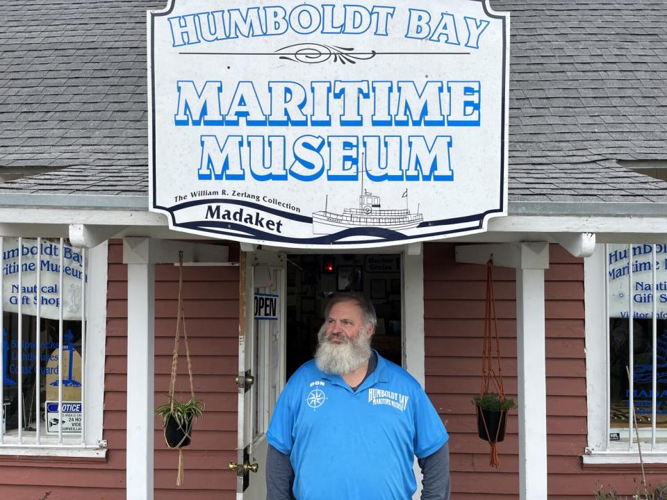 man stand outside of museum