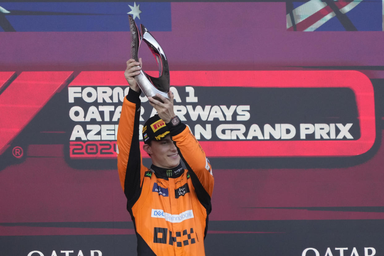 McLaren driver Oscar Piastri of Australia celebrates after he won the Formula One Grand Prix in Baku, Azerbaijan, on Sunday, Sept. 15, 2024. (AP Photo/Sergei Grits)