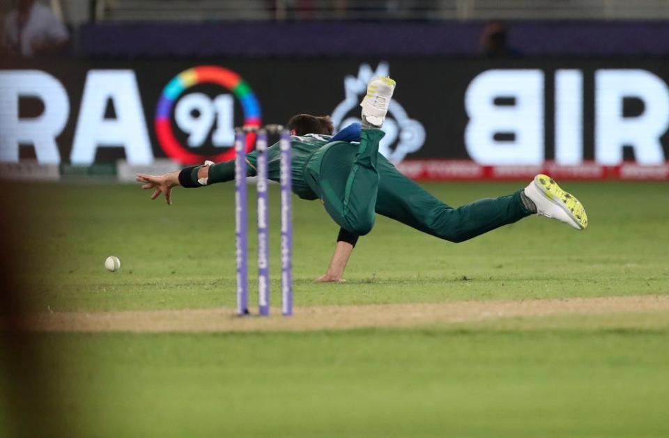 Pakistan’s Shaheen Afridi dives to field the ball during his side’s T20 World Cup win over India (Aijaz Rahi/PA) (AP)