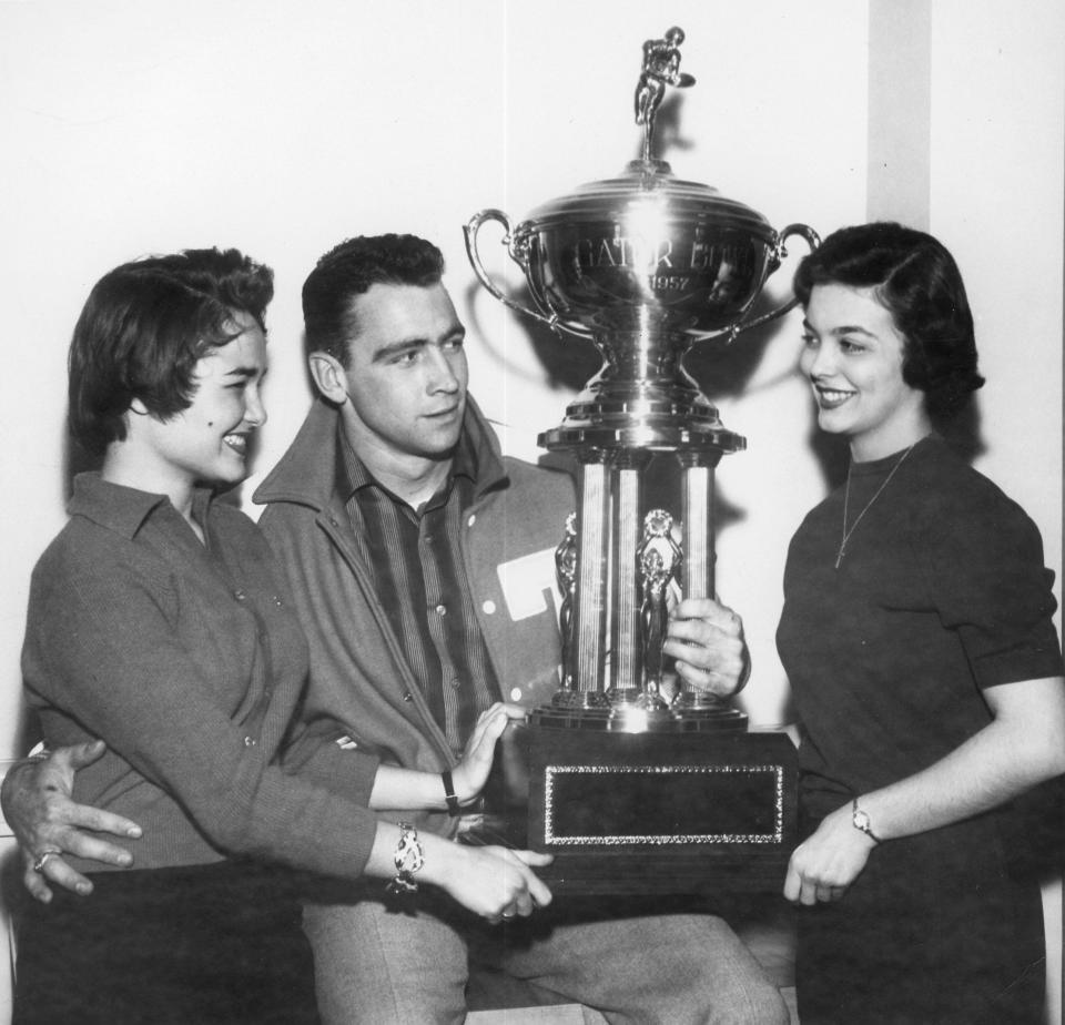 Tennessee tailback Bobby Gordon poses with the 1957 Gator Bowl trophy. He was named MVP of the game after the Vols beat Texas A&M 3-0.