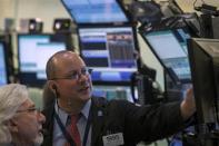 Traders work on the floor of the New York Stock Exchange March 28, 2014. REUTERS/Brendan McDermid