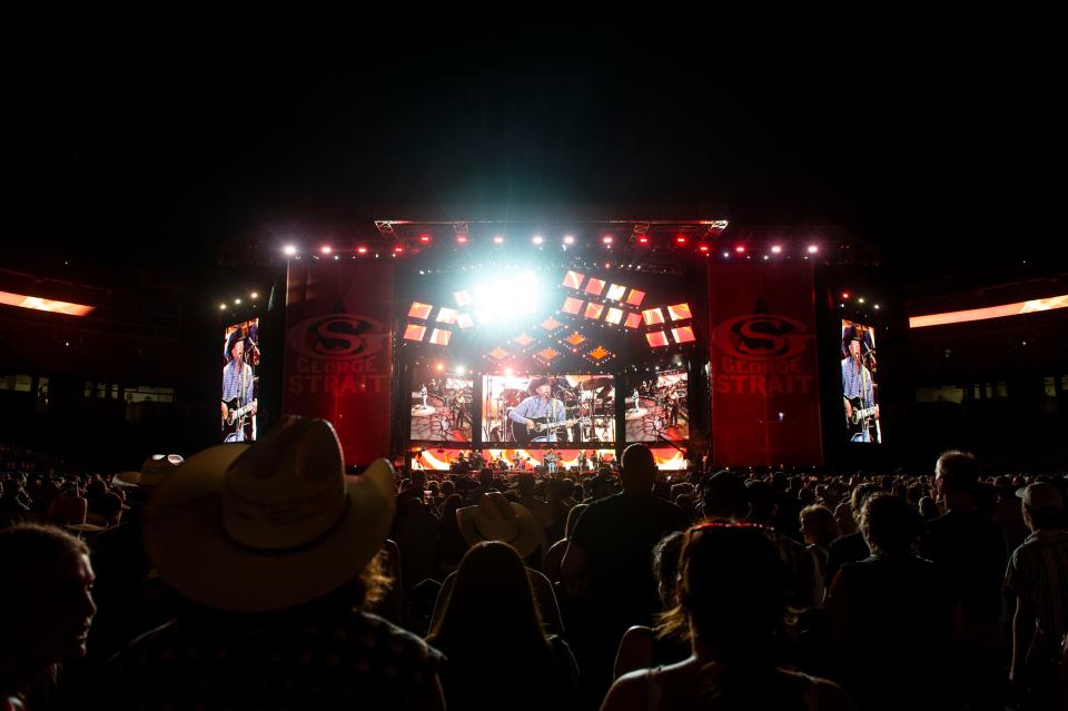 The crowd stands as George Strait performs at Nissan Stadium in Nashville , Tenn., Friday, July 28, 2023.