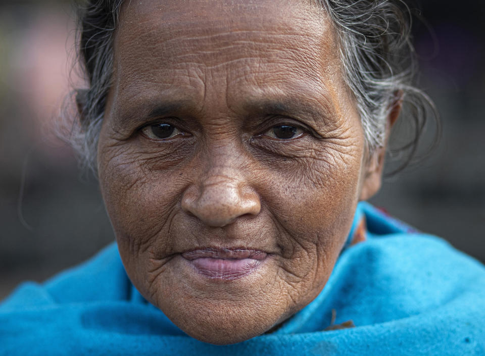 In this Monday, Dec. 23, 2019, photo, Maya Choudhary, 62, participates in a protest against the Citizenship Amendment Act (CAA) in Gauhati, India. Tens of thousands of protesters have taken to India’s streets to call for the revocation of the law, which critics say is the latest effort by Narendra Modi’s government to marginalize the country’s 200 million Muslims. Choudhary said she will fight against CAA and hoped the government would withdraw the act soon. (AP Photo/Anupam Nath)