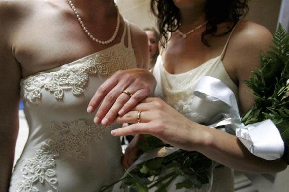 Sharon Papo (R) and her partner Amber Weiss display their wedding rings after exchanging wedding vows at City Hall on the first full day of legal same-sex marriages in San Francisco, California June 17, 2008. Gay marriage supporters see the move by the most populous U.S. state to allow same-sex weddings as an historic move long overdue, while opponents brand it a moral tragedy.
