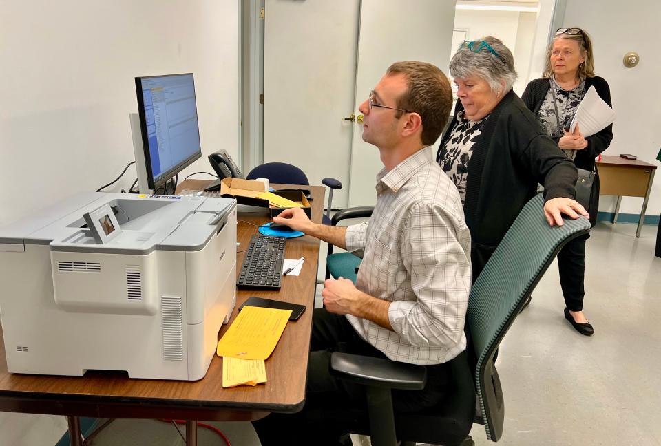 Maury County Administrator of Elections Chris Mackinlay counts votes from various precincts during the March 5, 2024 Presidential Preference and County Primary Elections at the Maury County Election Commission.
