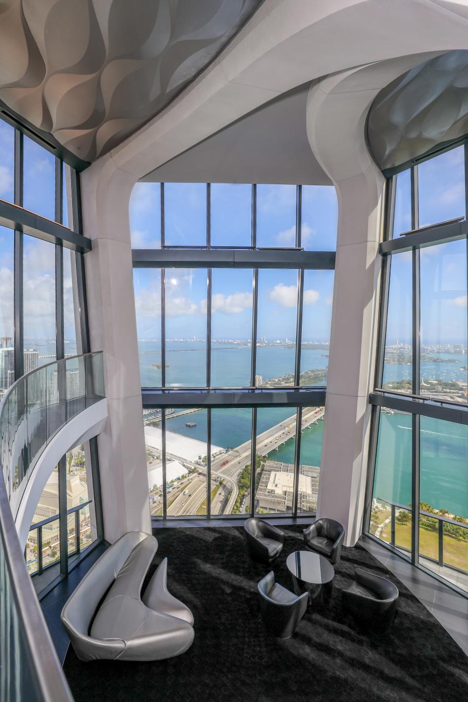 Top of tower is an event space and aquatic center with a feature ceiling. The residential building also has a private helipad.