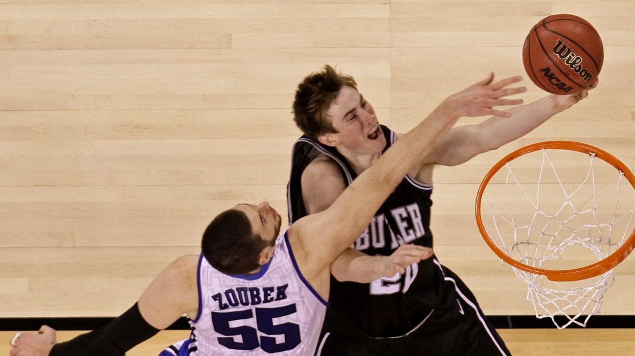 Mandatory Credit: Photo by Mark J Terrill/AP/Shutterstock (6332969an)Butler's Gordon Hayward, right, drives to the basket past Duke's Brian Zoubek (55) during the second half of the men's NCAA Final Four college basketball championship game, in IndianapolisNCAA Final Four Butler Duke Basketball, Indianapolis, USA.