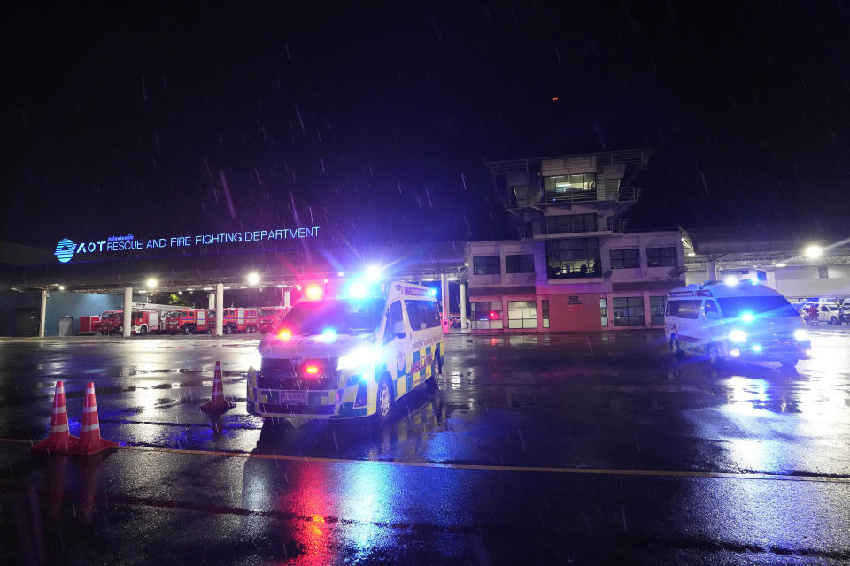 Ambulances are seen at the airport where a London-Singapore flight that encountered severe turbulence was diverted to, in Bangkok, Thailand, Tuesday, May 21, 2024. The plane apparently plummeted for a number of minutes before it was diverted to Bangkok, where emergency crews rushed to help injured passengers amid stormy weather, Singapore Airlines said Tuesday. (AP Photo/Sakchai Lalit)