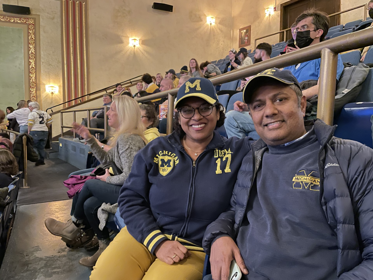 Praveena Ramaswami, 46, and her husband Madhan, 51, return to the Michigan Theater to watch the University of Michigan football team compete in the national championship game on Monday, Jan. 8, 2024 after watching the U-M team win the Rose Bowl a week before.