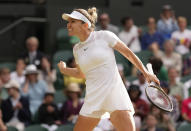 Romania's Simona Halep celebrates after beating Spain's Paula Badosa in a women's singles fourth round match on day eight of the Wimbledon tennis championships in London, Monday, July 4, 2022. (AP Photo/Alberto Pezzali)