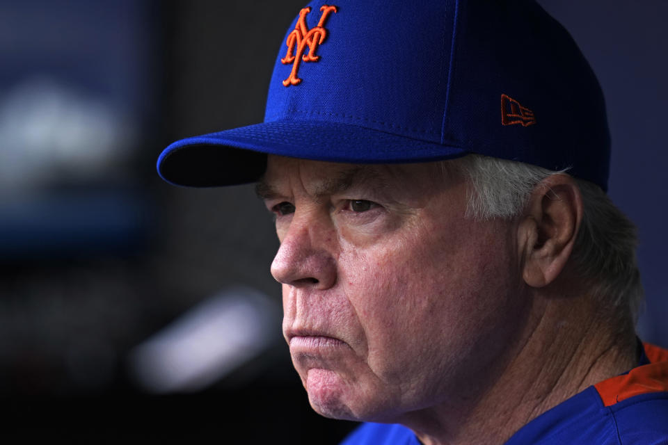 New York Mets manager Buck Showalter stands in the dugout before the team's baseball game against the Pittsburgh Pirates in Pittsburgh, Friday, June 9, 2023. The Pirates won 14-7. (AP Photo/Gene J. Puskar)