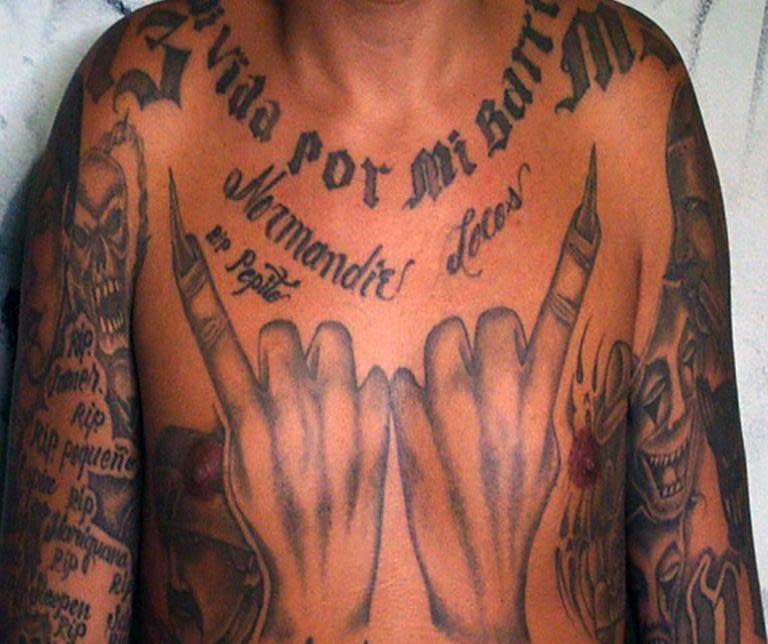 Honduras has been badly shaken by drug gangs that emerged in the 1980s, and here a member of Mara Salvatrucha displays his tattoos in Tegucigalpa