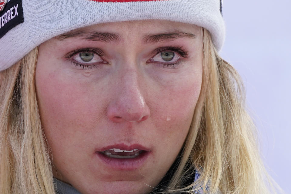 United States' Mikaela Shiffrin is overcome by emotion as she stands on the podium after winning an alpine ski, women's World Cup giant slalom race, in Kranjska Gora, Slovenia, Sunday, Jan. 8, 2023. Shiffrin matched Lindsey Vonn's women's World Cup skiing record with her 82nd win Sunday. (AP Photo/Giovanni Auletta)