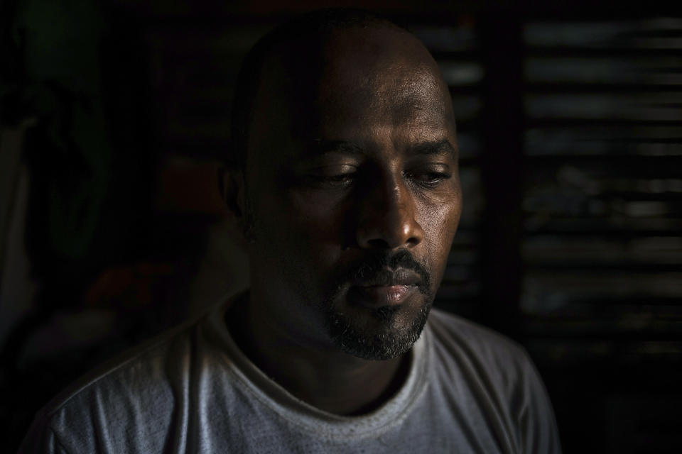 39-years-old merchant Oumar Youssouf, is photographed at the Apostolic Seminary where he seeked shelter in Bangassou, Central African Republic, Tuesday, Feb. 16, 2021. His clothing boutique was looted when the Coalition of Patriots for Change left Bangassou mid January. Youssouf said that insecurity on trade routes won't allow him to renew his stock and start over again. An estimated 240,000 people have been displaced in the country since mid-December, according to U.N. relief workers, when rebels calling themselves the Coalition of Patriots for Change launched attacks, causing a humanitarian crisis in the already unstable nation. (AP Photo/Adrienne Surprenant)