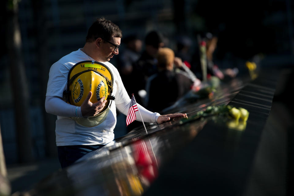 <p>James Taormina, whose brother Dennis was killed in the 9/11 attacks, pauses at the memorial before a commemoration ceremony for the victims of the attacks at the National September 11 Memorial, Sept. 11, 2017, in New York City. (Photo: Drew Angerer/Getty Images) </p>