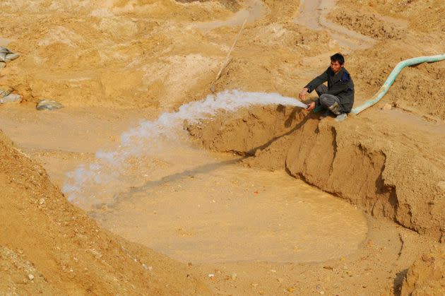 A labourer hoses water into the site of a rare earth metals mine at Nancheng county, Jiangxi province December 21, 2010. China's monthly exports of rare earth metals more than doubled in November to 2,090 tonnes, bouncing back after falling by more than three-quarters in October, data supplied by China Customs Statistics Information Centre (HK) showed. REUTERS/Stringer (CHINA - Tags: BUSINESS) CHINA OUT. NO COMMERCIAL OR EDITORIAL SALES IN CHINA (Photo: Stringer Shanghai via Reuters)