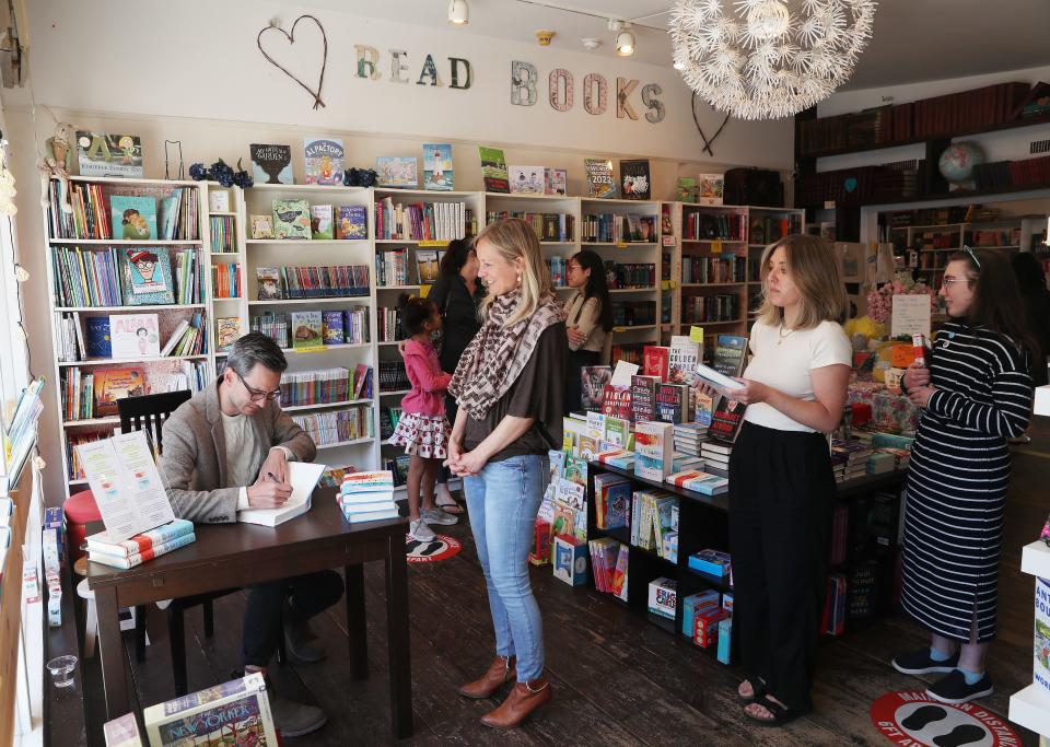 Nyack native Soon Wiley signs a copy of his debut novel "When We Fell Apart" at Booksy Galore in Pound Ridge April 30, 2022. The book is getting over-the-top buzz in the publishing world.