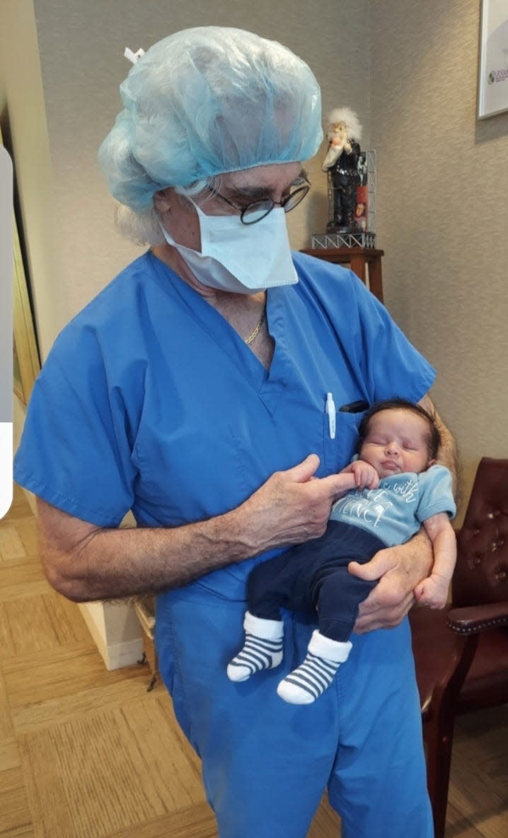 Baby Koston meets Dr. Lawrence B. Werlin for the first time.