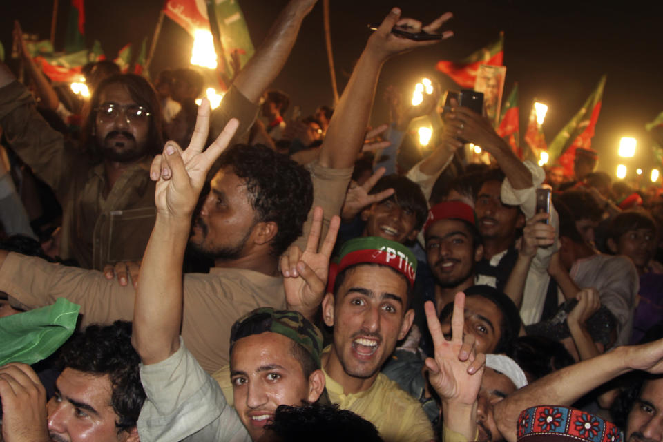 Supporters of Pakistani opposition leader Imran Khan's Tehreek-e-Insaf party attend a rally, in Peshawar, Pakistan, Tuesday, Sept. 6, 2022. Since he was toppled by parliament five months ago, former Prime Minister Imran Khan has demonstrated his popularity with rallies that have drawn huge crowds and signaled to his rivals that he remains a considerable political force. (AP Photo/Mohammad Sajjad)