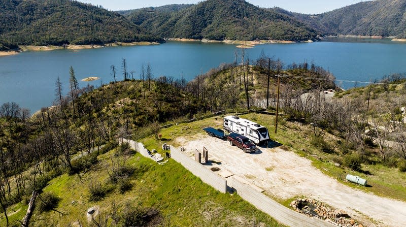 A trailer stands at a property scorched in the 2020 North Complex Fire above Lake Oroville on March 26, 2023, in Butte County, California. 