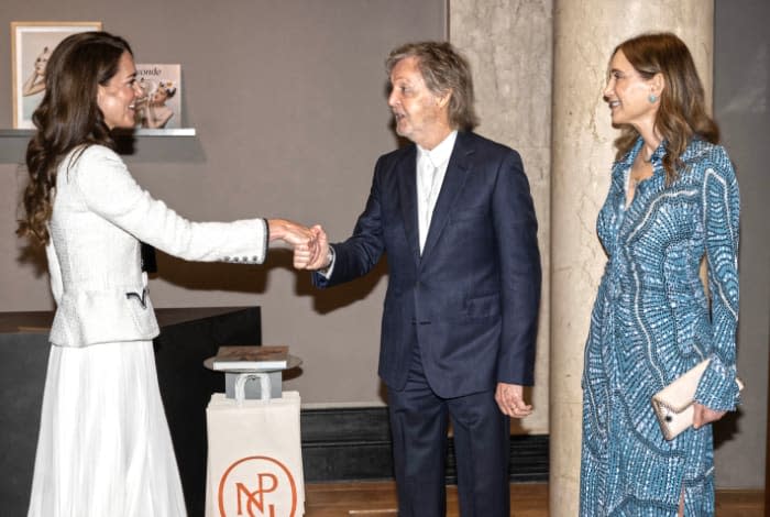 La princesa de Gales junto a Paul McCartney y su esposa, Nancy Shevell Esposa