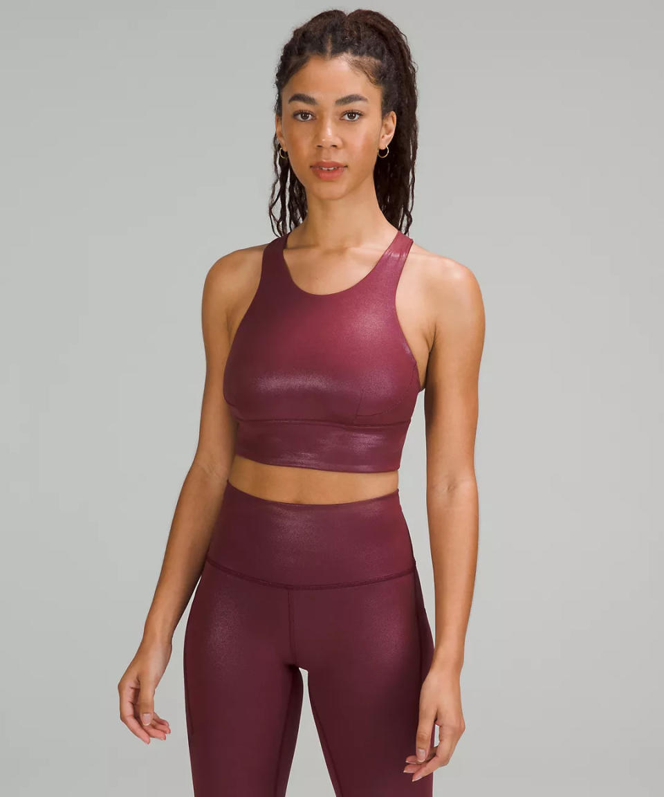 model wears merlot coloured Wunder Train Longline Bra Foil, Medium Support, C/D Cup. Image via lululemon.